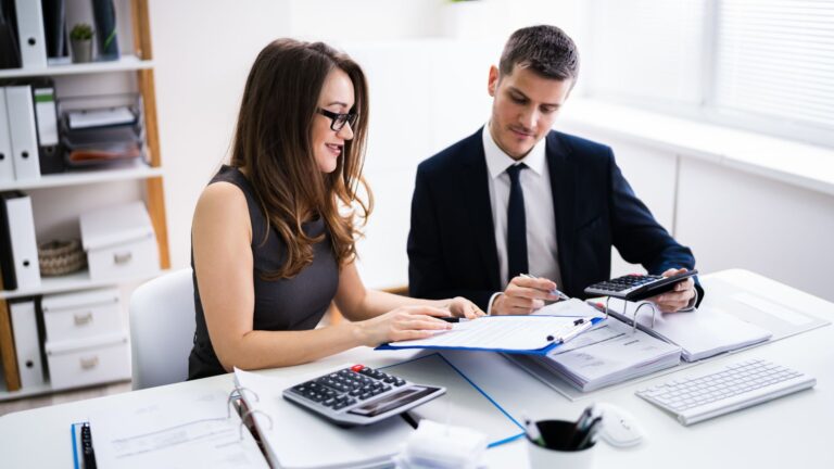 Business owners reviewing finances